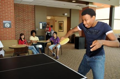 student playing ping pong